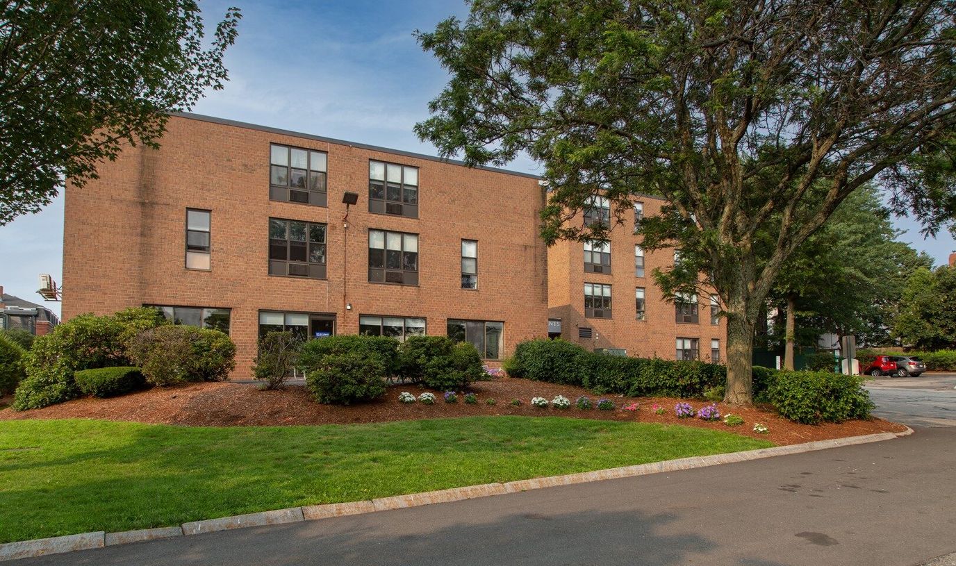 Exterior view of Mt. Pleasant Apartments with landscaping