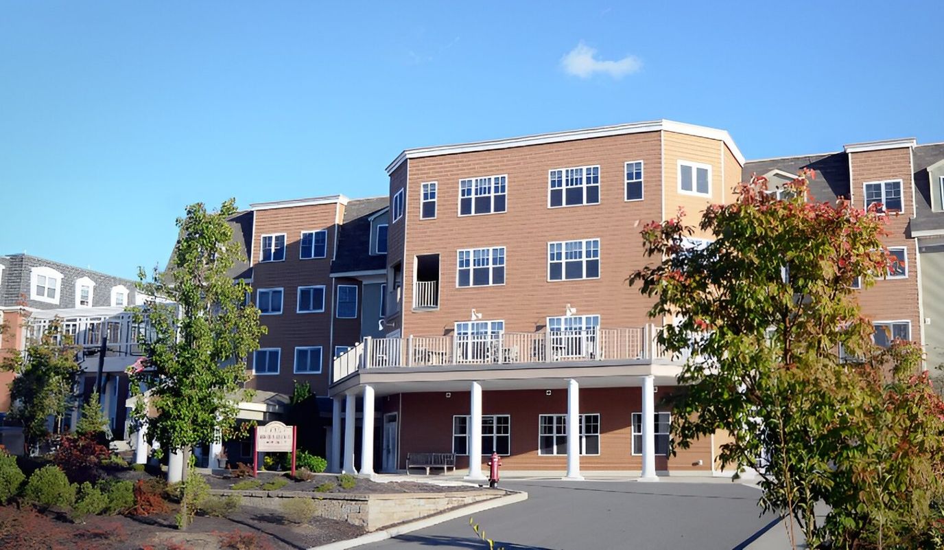 Exterior view of a senior living facility with balcony