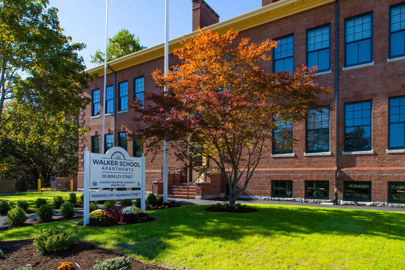 Building exterior of Walker School Apartments with signage
