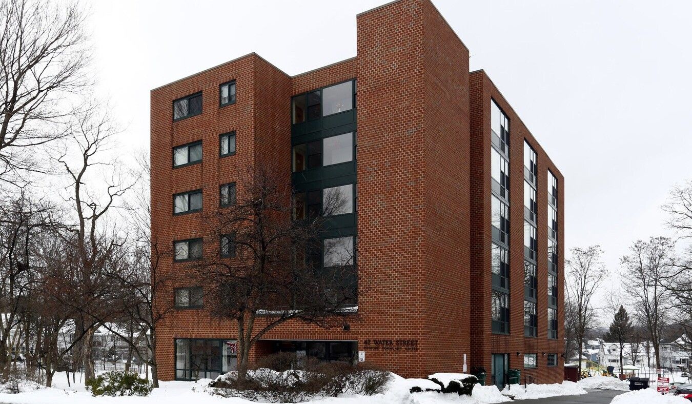 Exterior view of Water Street Apartments in winter
