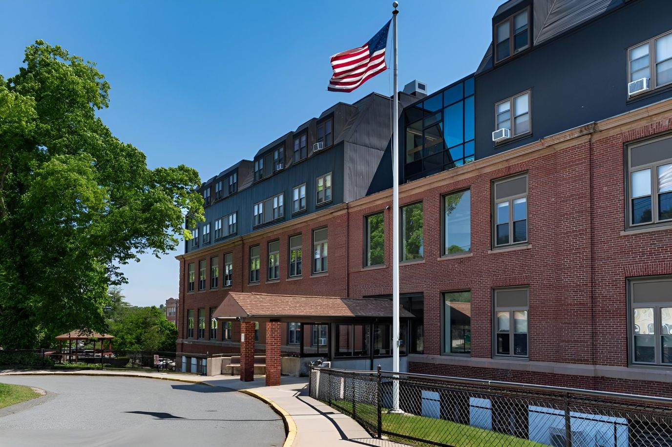 Exterior view of Weldon Gardens with American flag