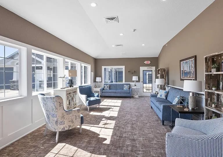 Bright lounge area with comfortable seating and large windows