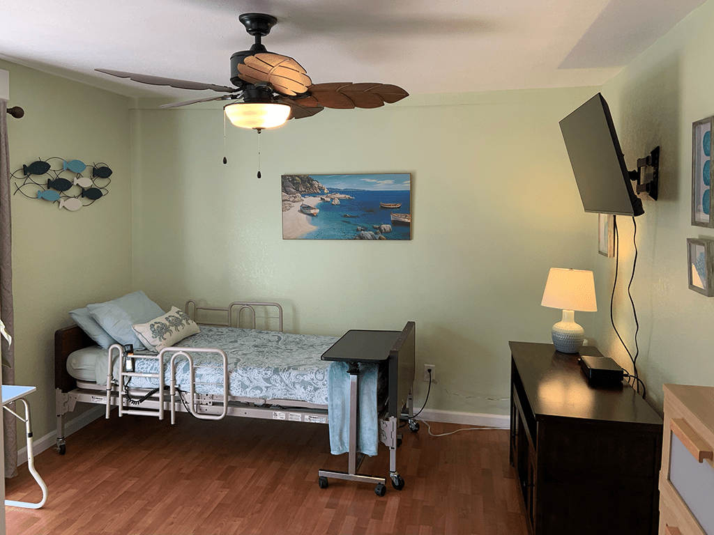 Eclipse Home Care LLC, home care in Denver, CO — Cozy bedroom with a hospital bed and wall art