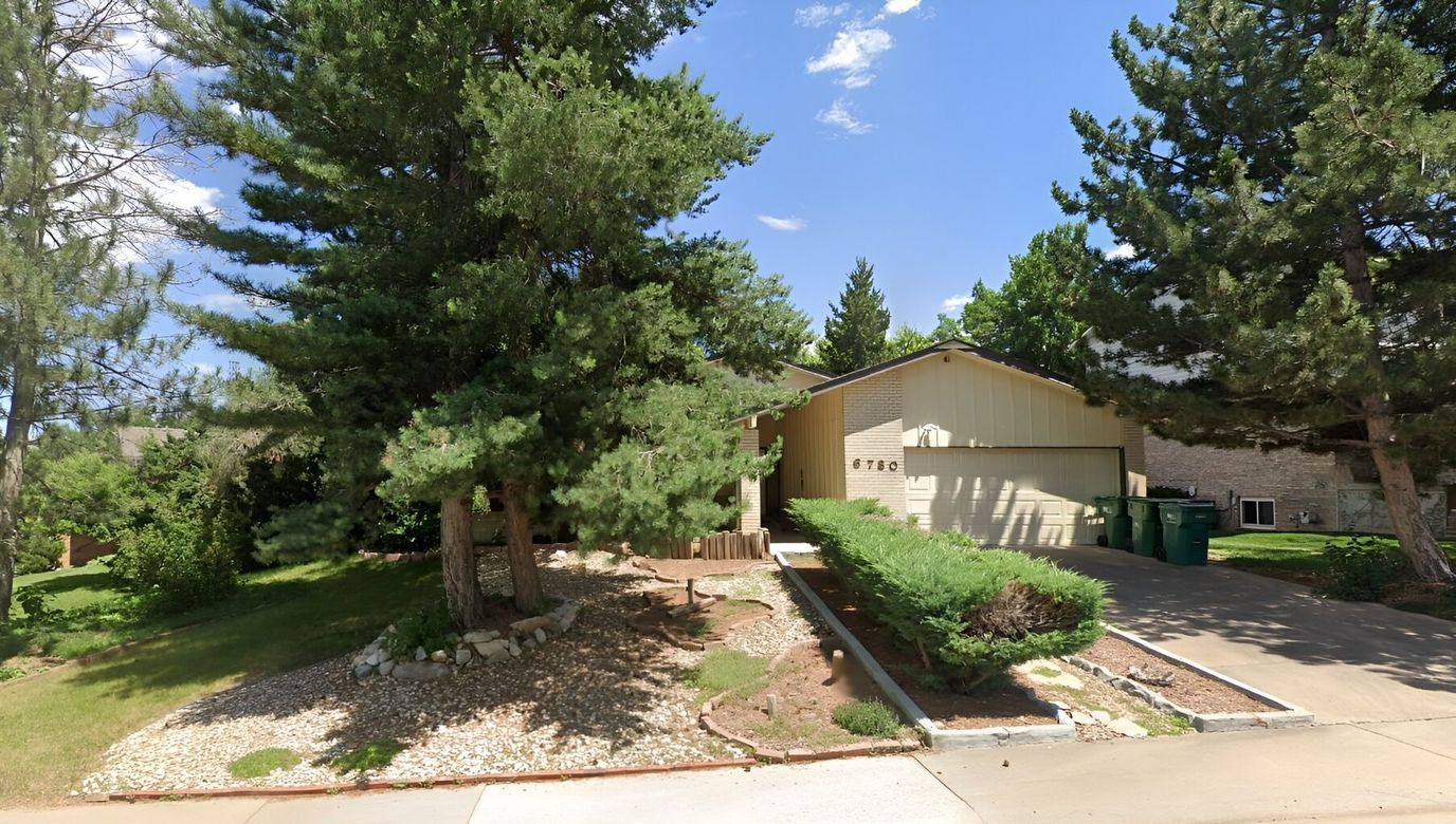 Exterior view of a house surrounded by trees