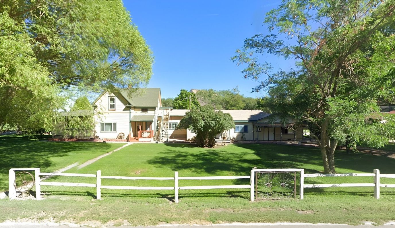 Exterior view of Peachtree Assisted Living building and gardens