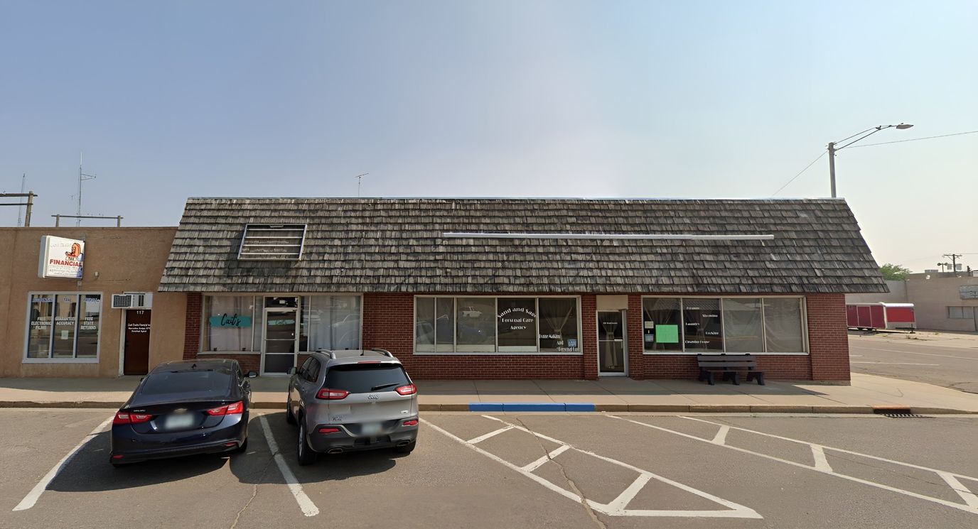 Exterior view of a facility building with parking space