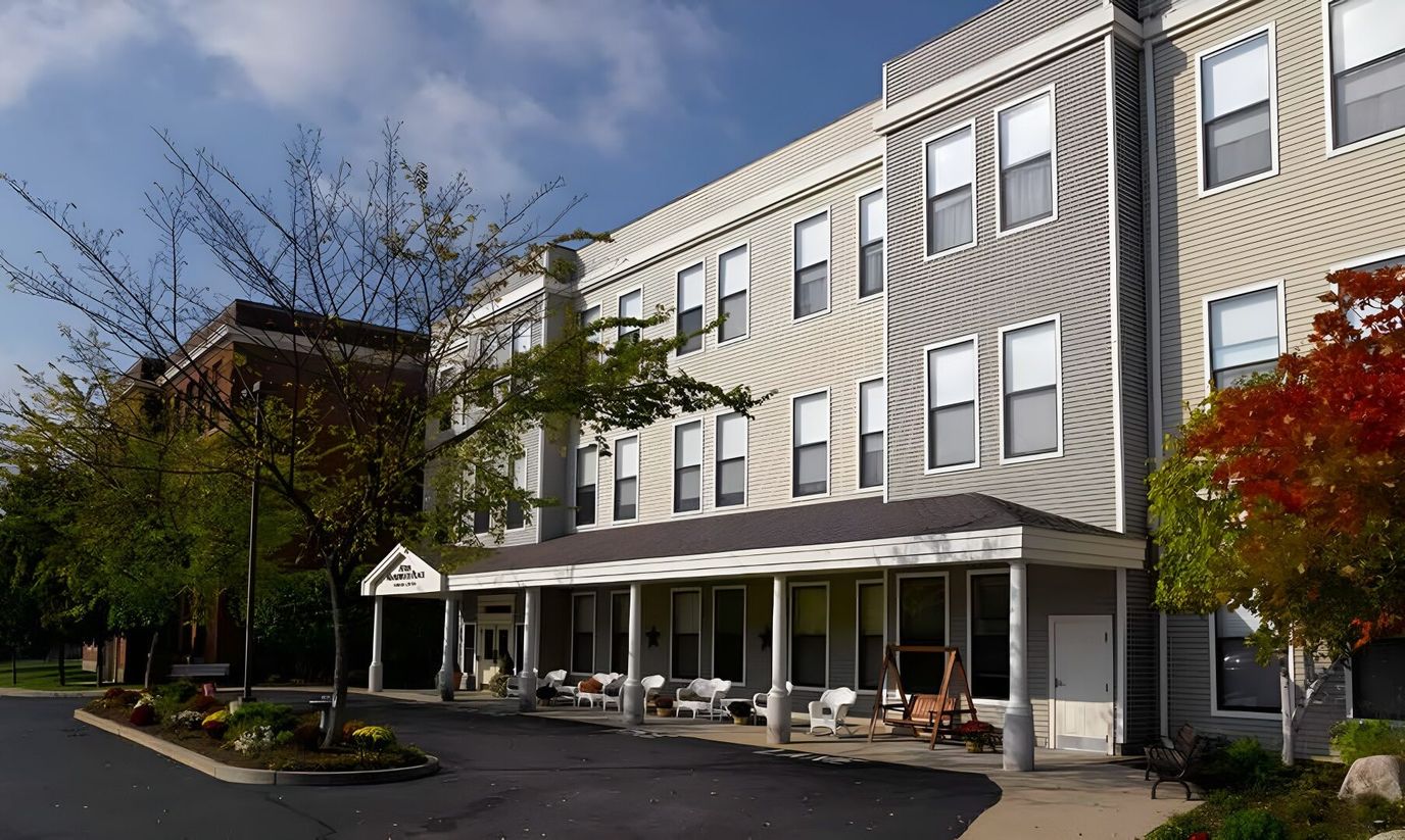 Exterior view of Atria Maplewood Place with seating area