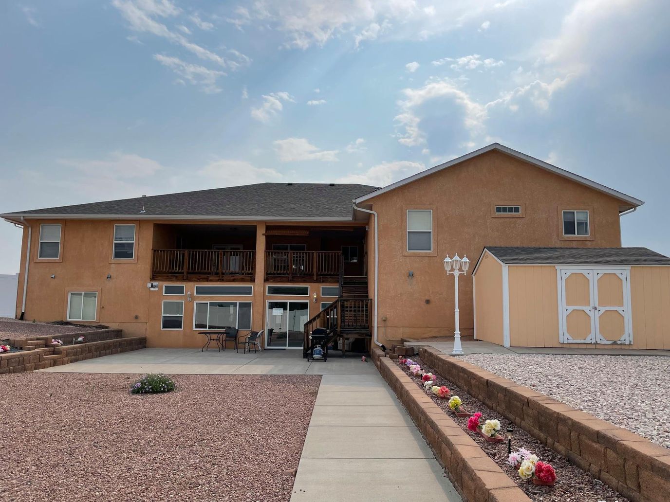 Exterior view of a senior care facility with outdoor seating