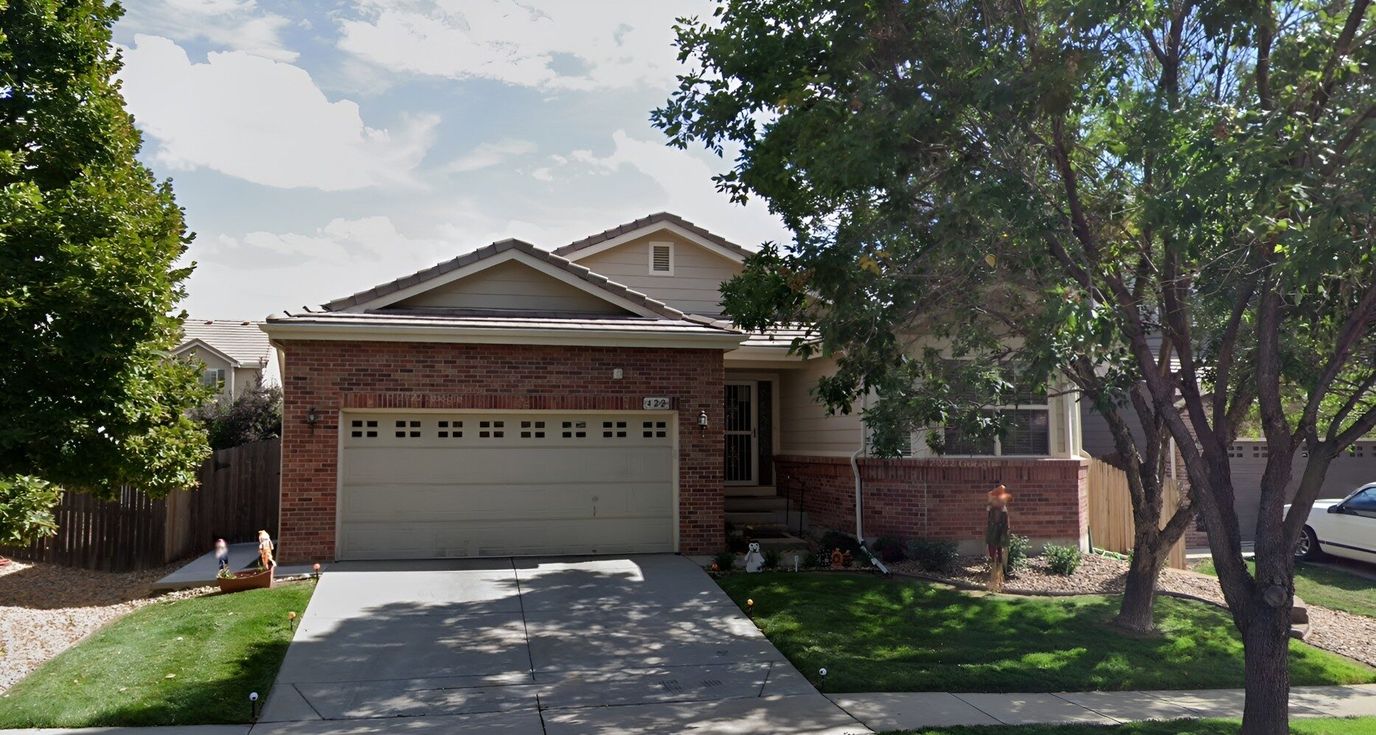 Exterior view of a residential building with landscaping