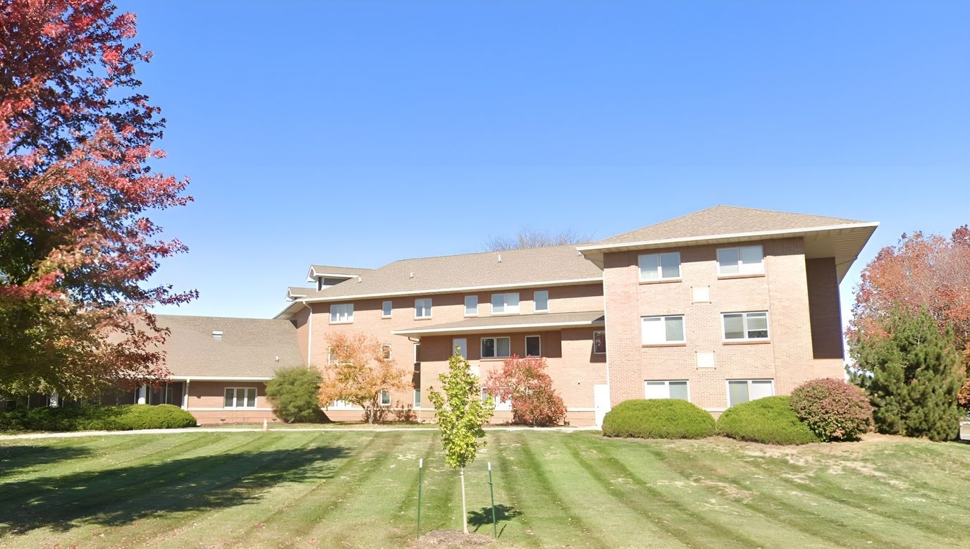 Exterior view of Martina Place with autumn trees
