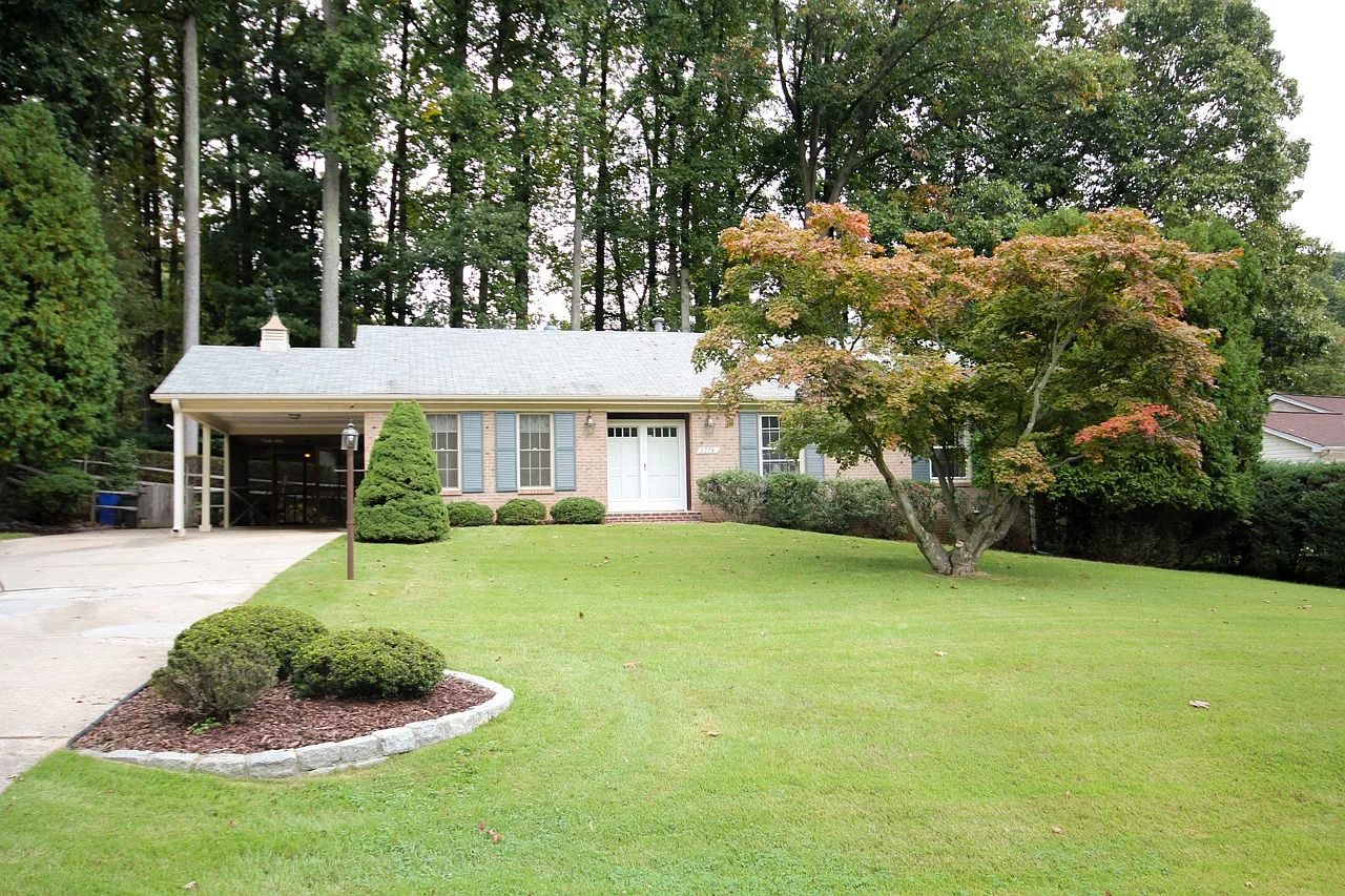 Exterior view of a residential facility with landscaped yard