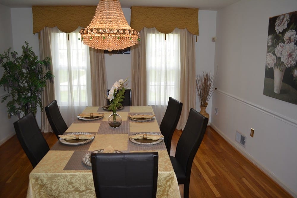 Brightly lit dining area with a large dining table