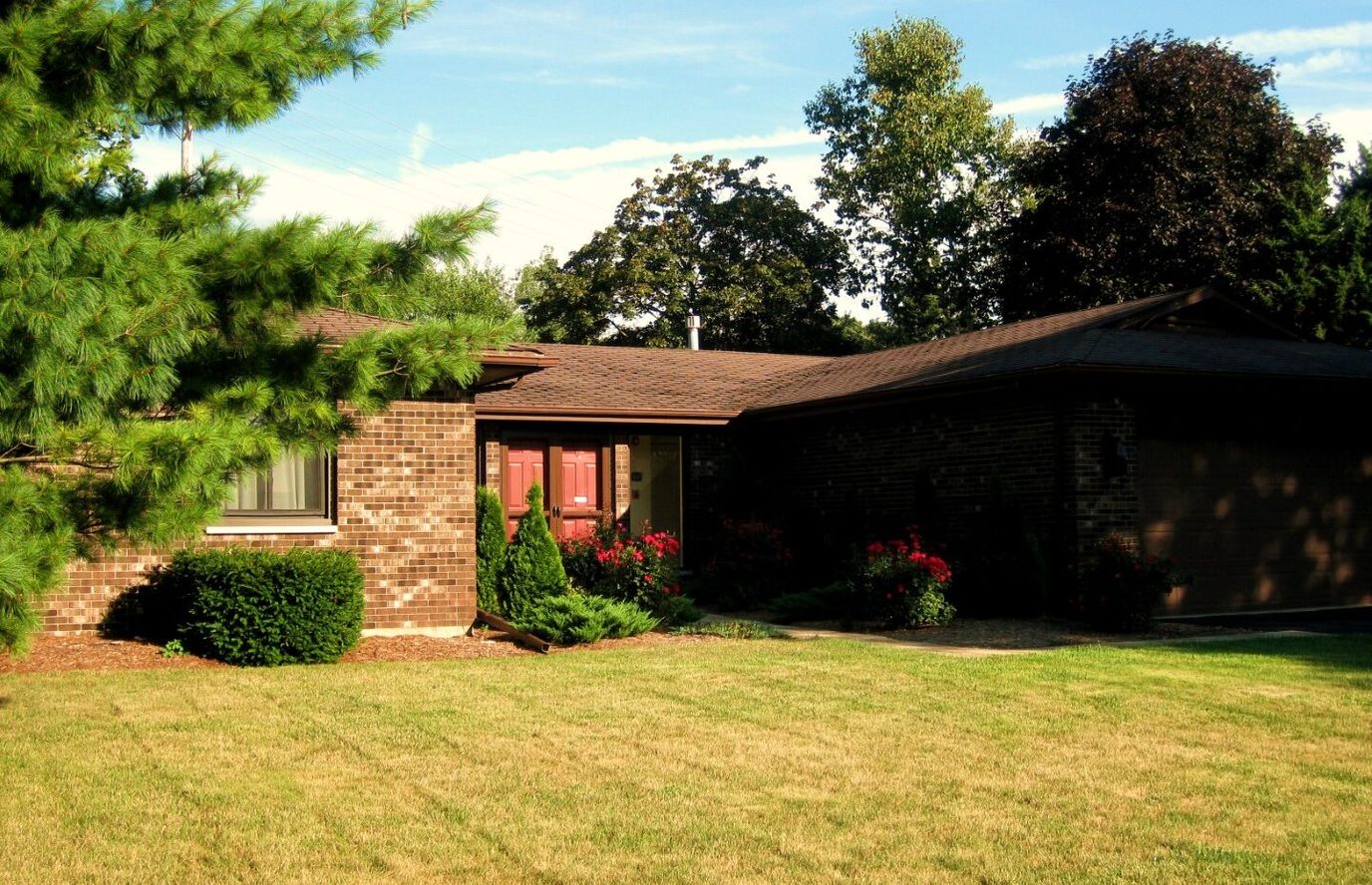 Exterior view of a single-story facility with landscaping