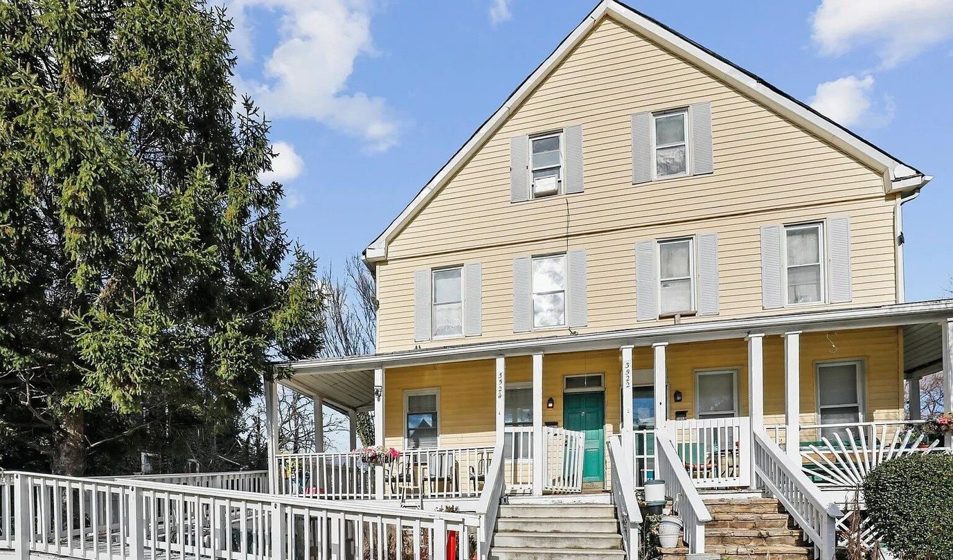 Exterior view of a yellow assisted living facility