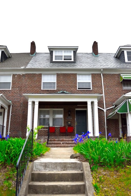 Exterior view of a senior living facility with flowers