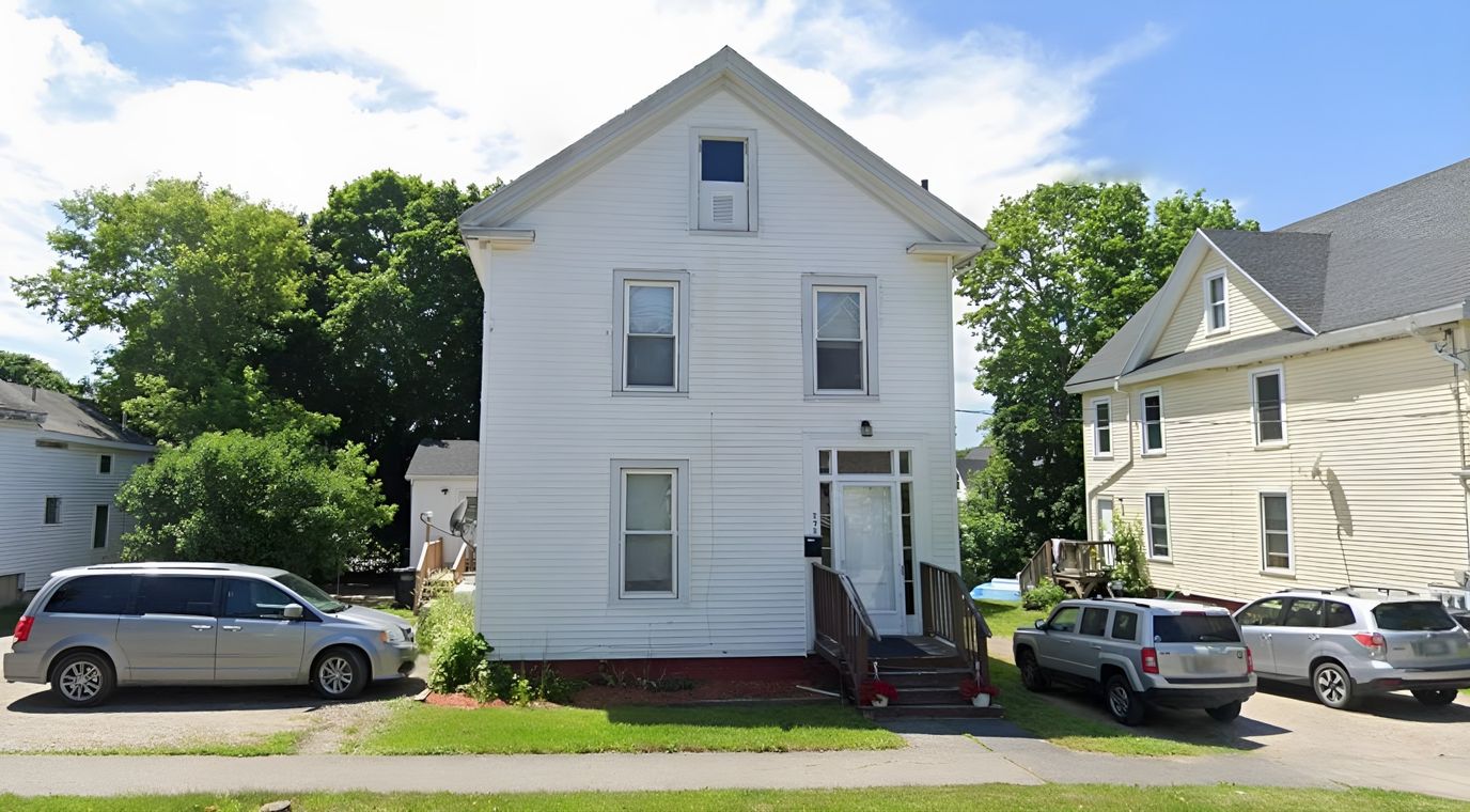 Front view of a white facility building