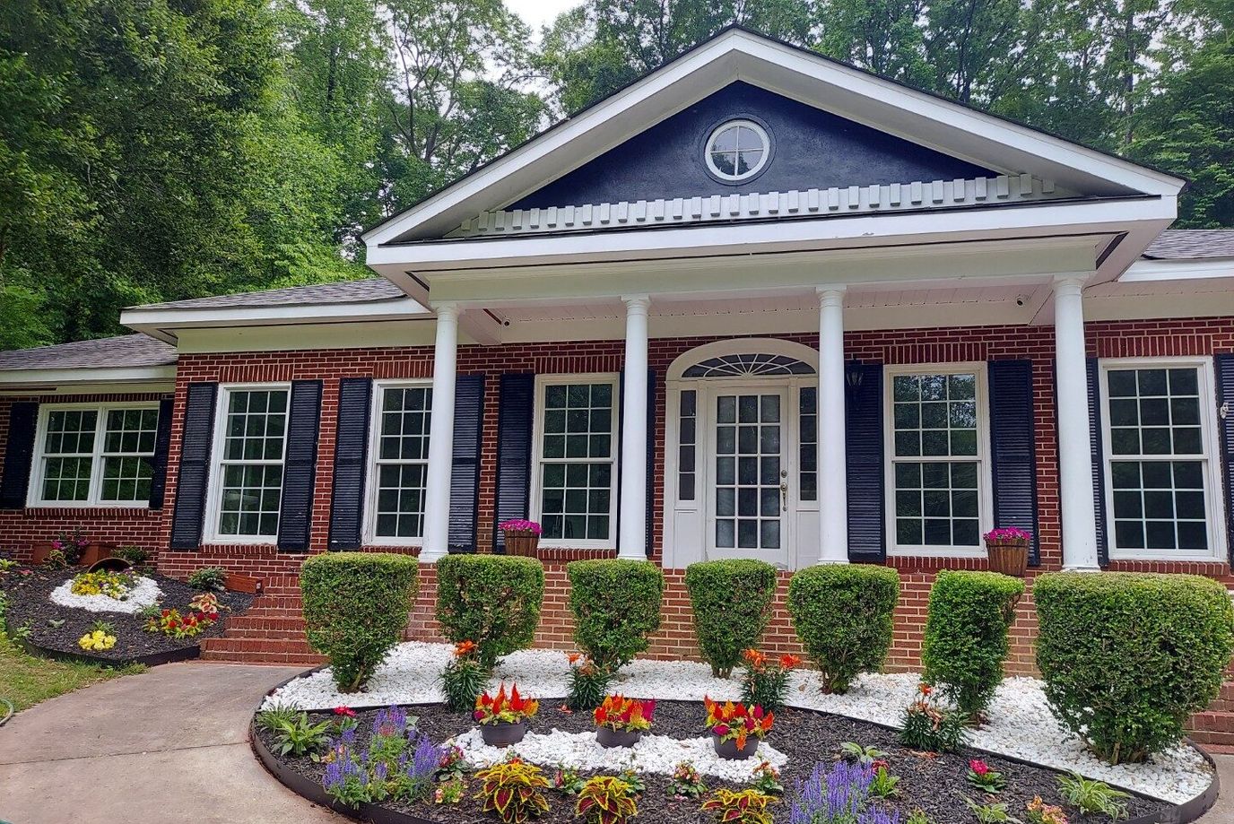 Exterior view of a senior care facility with landscaped garden
