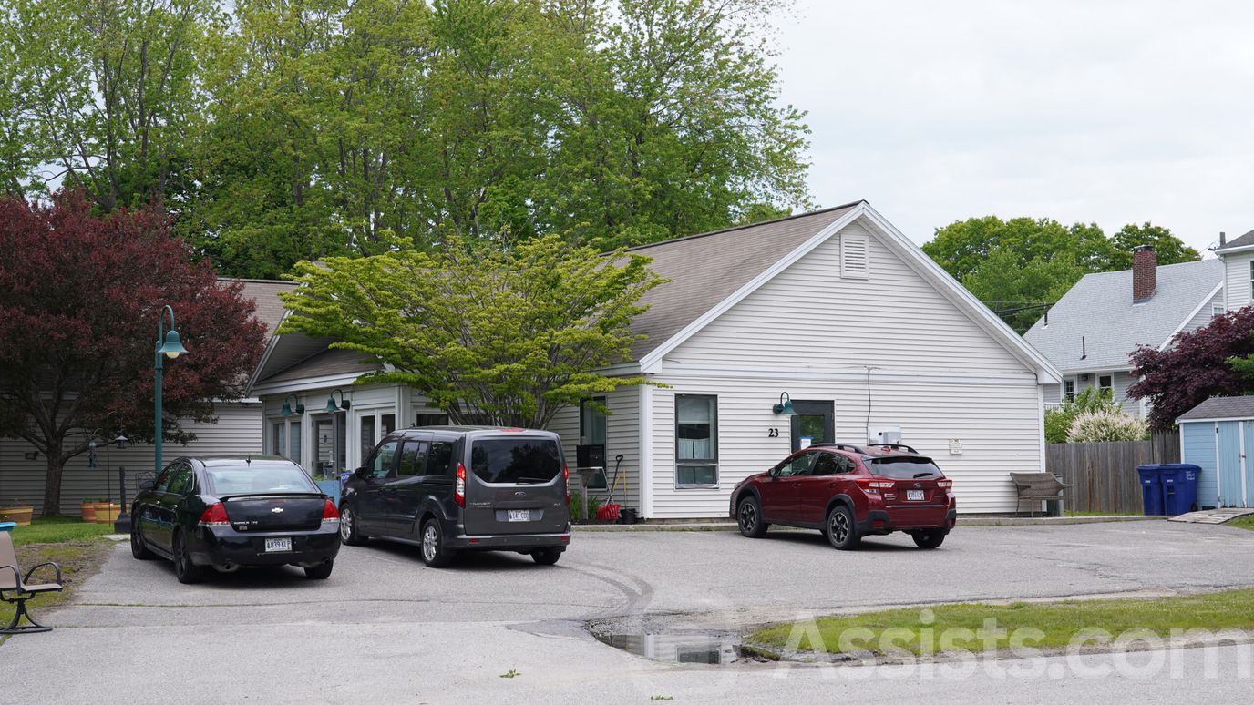 Exterior view of the facility with parked cars
