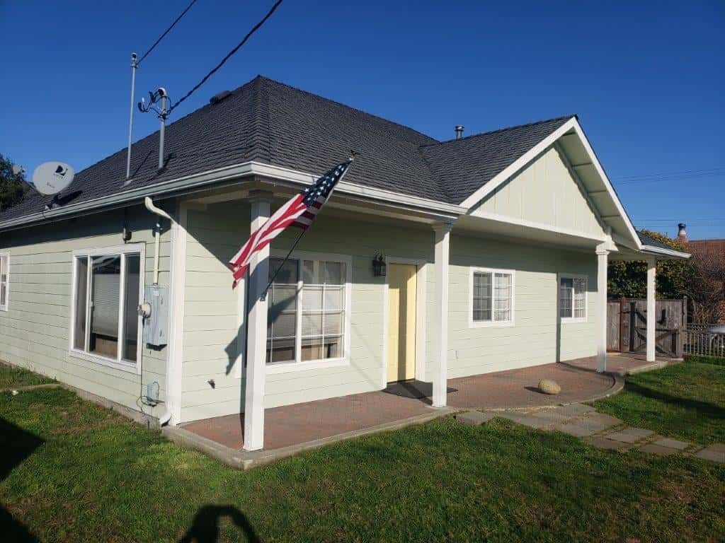 Exterior view of a residential facility with American flag.