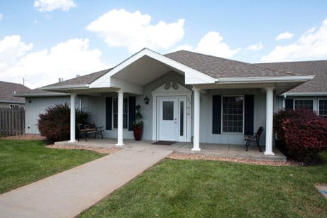 Dignity Care Home, assisted living in Las Vegas, NV — Senior living facility entrance with decorative landscaping
