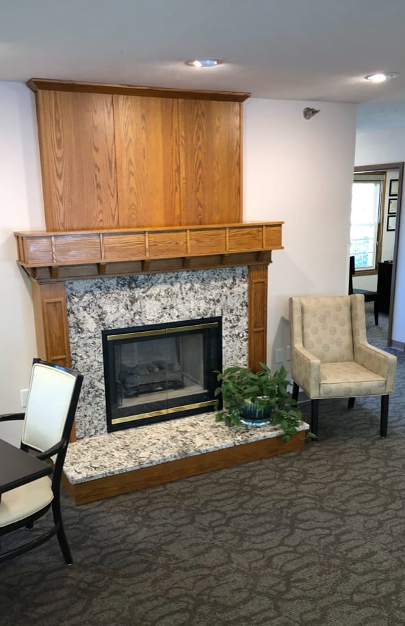 Cozy common area with a fireplace and seating