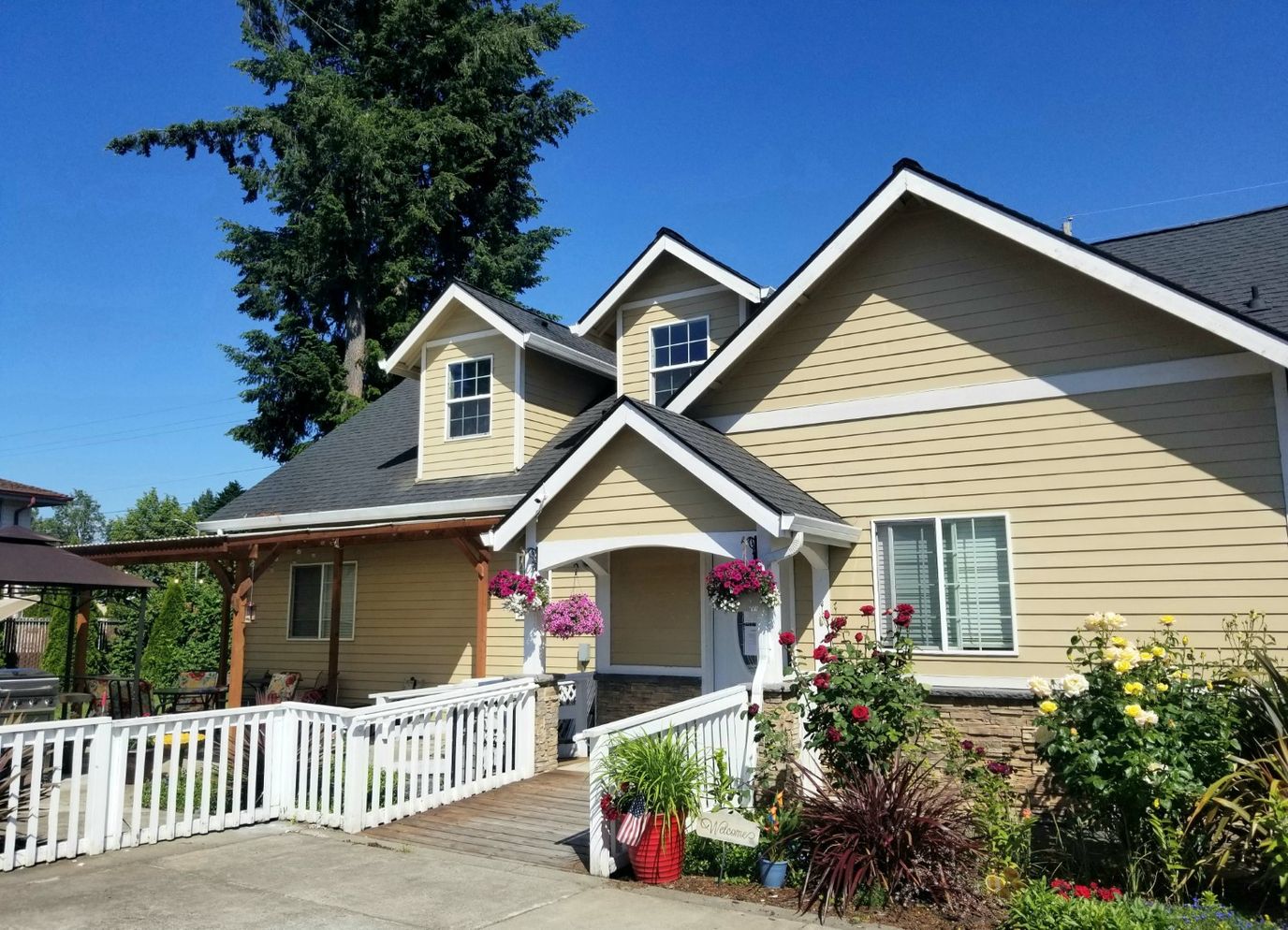 Exterior view of a residential care facility with garden