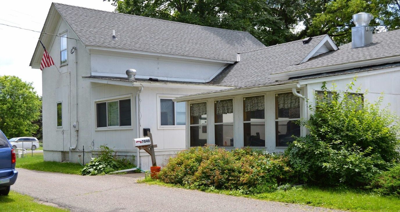 Exterior view of a senior care facility with garden area