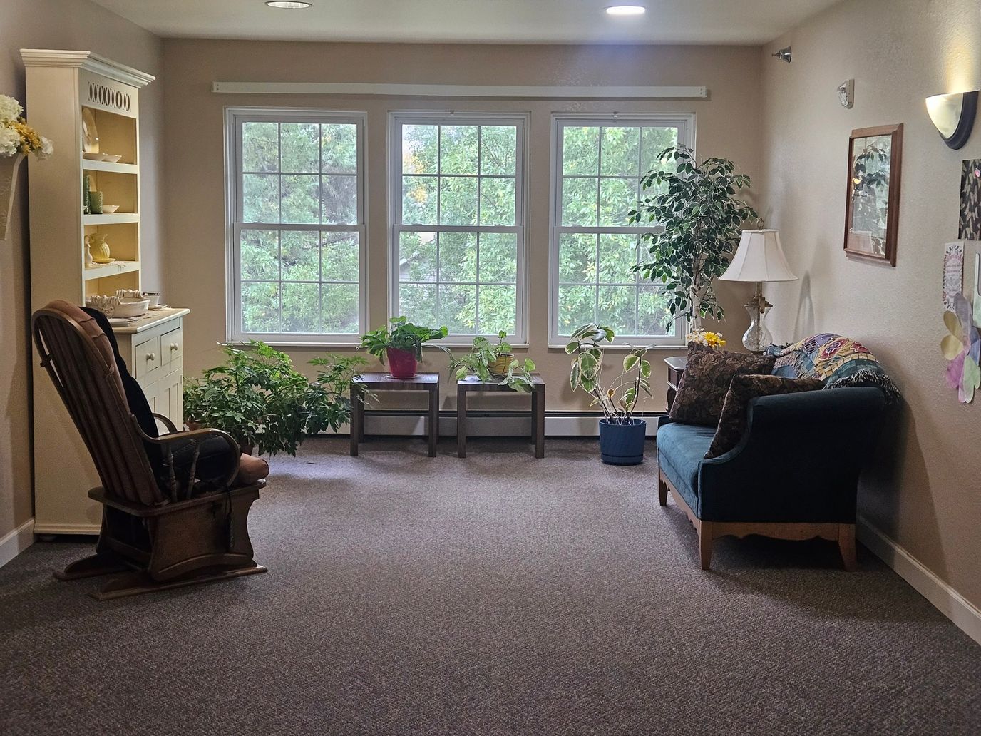 Cozy common area with plants and comfortable seating