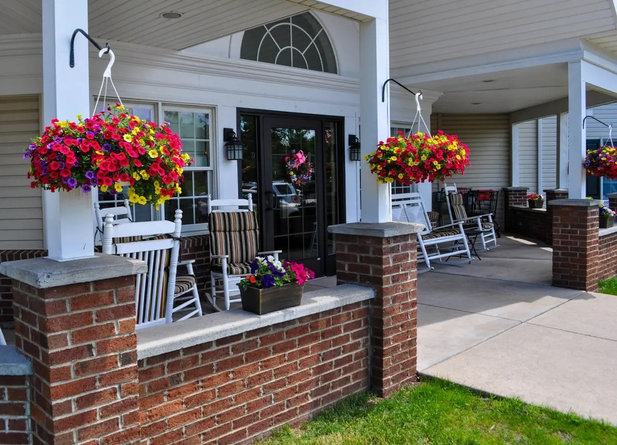 Outdoor seating area with colorful flower pots