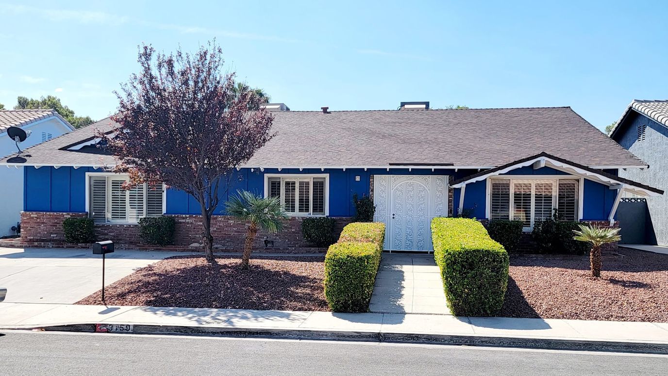 Exterior view of a blue residential building.