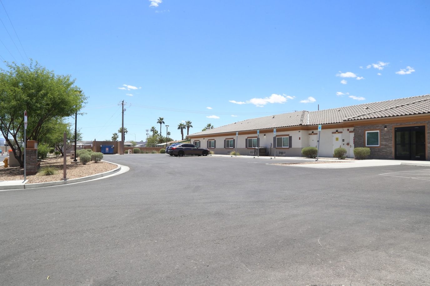 Exterior view of the facility with landscaped area.