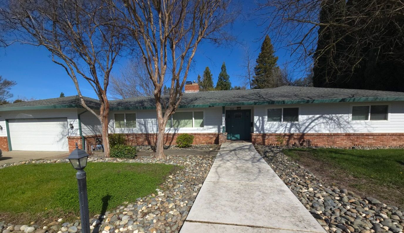 Front exterior view of the facility with landscaped path