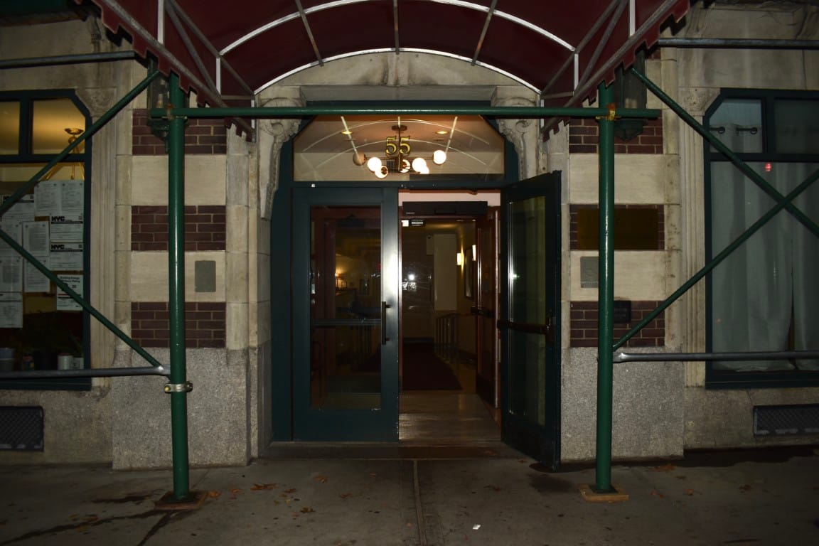 Entrance to a senior living facility with canopy and double doors