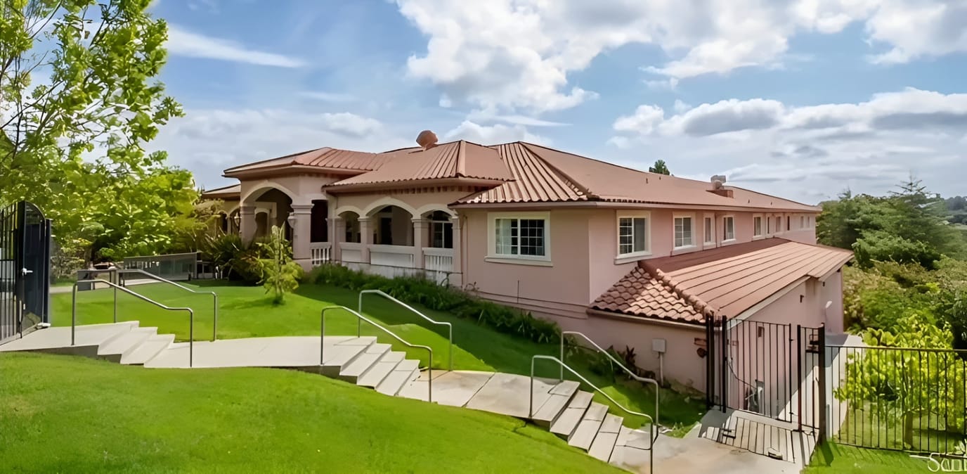Exterior view of Bayview Villa with landscaped surroundings