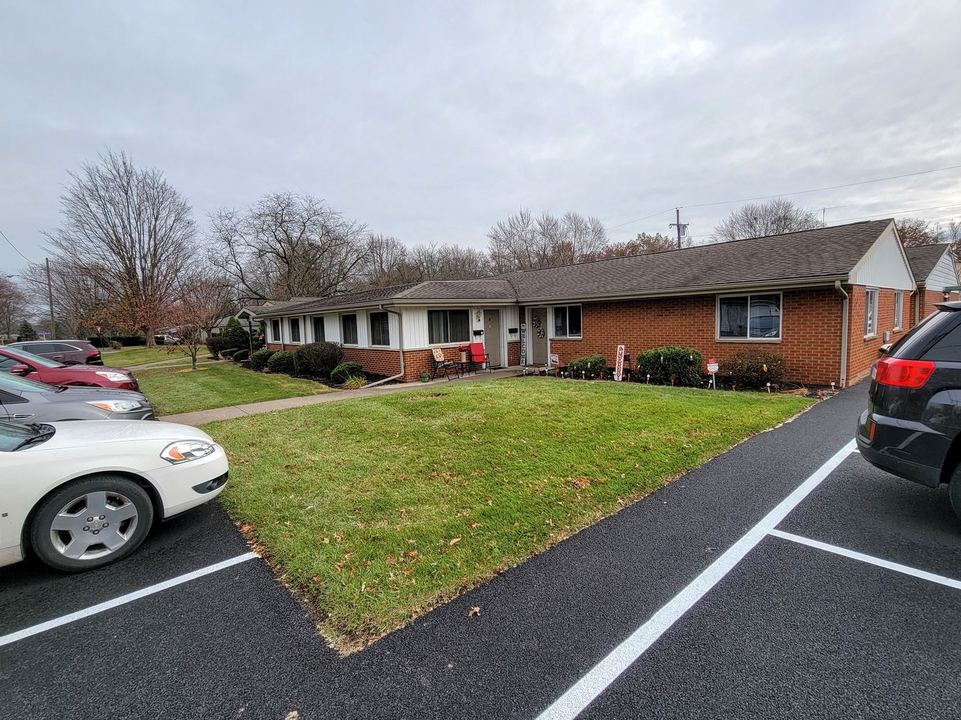 Building exterior of Gleenwood Senior Housing with parking area