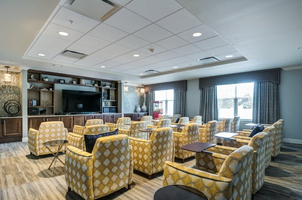 Common area with stylish seating and a TV