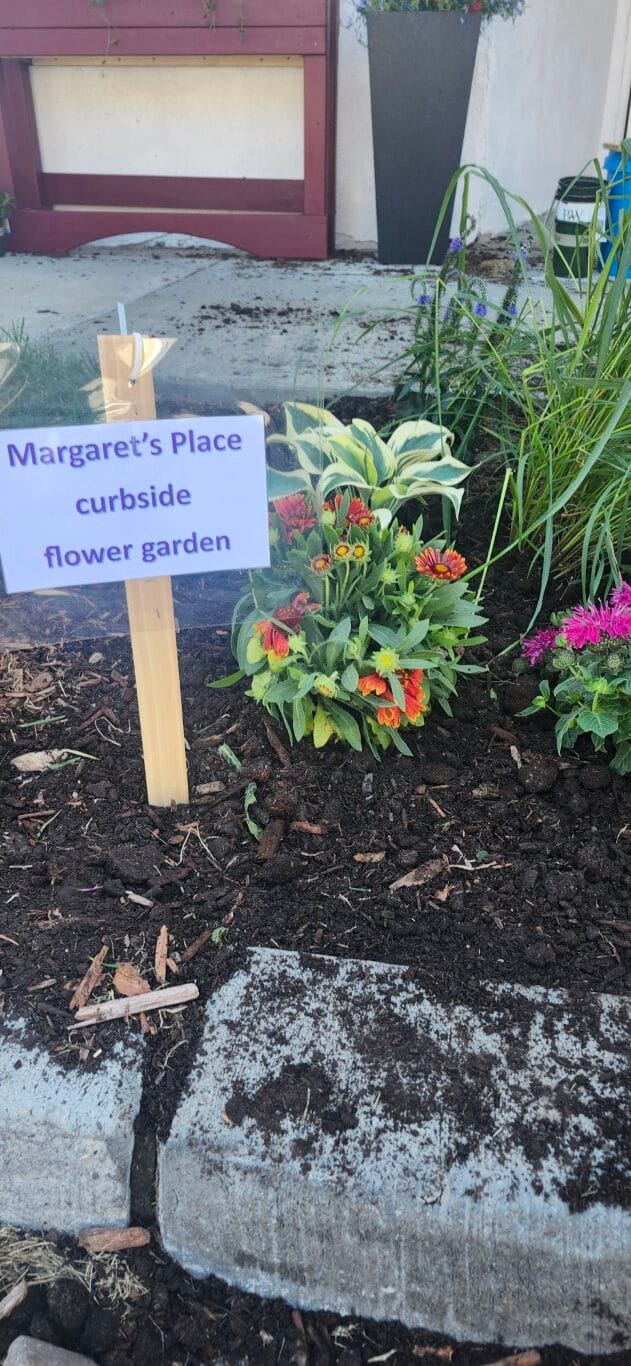 Curbside flower garden at Margaret's Place