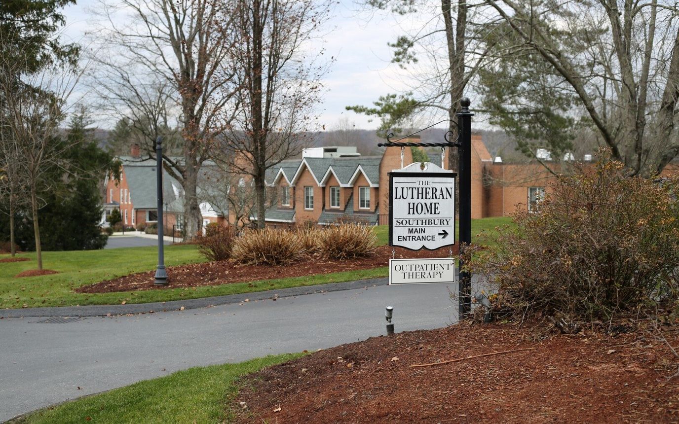 Sign for the Lutheran Home with exterior view