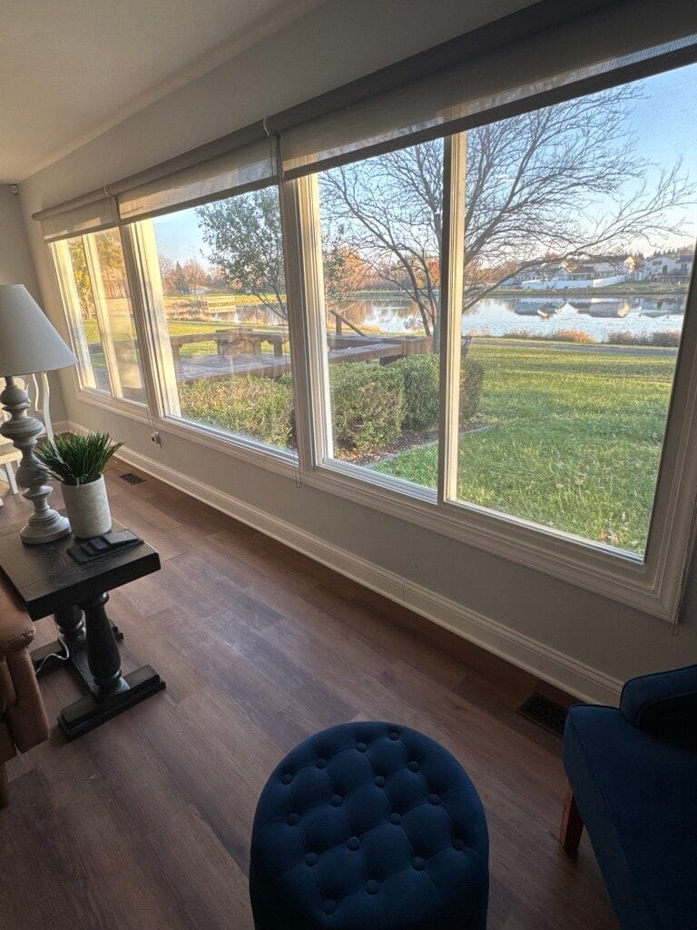 View from a sunny lounge overlooking a lake