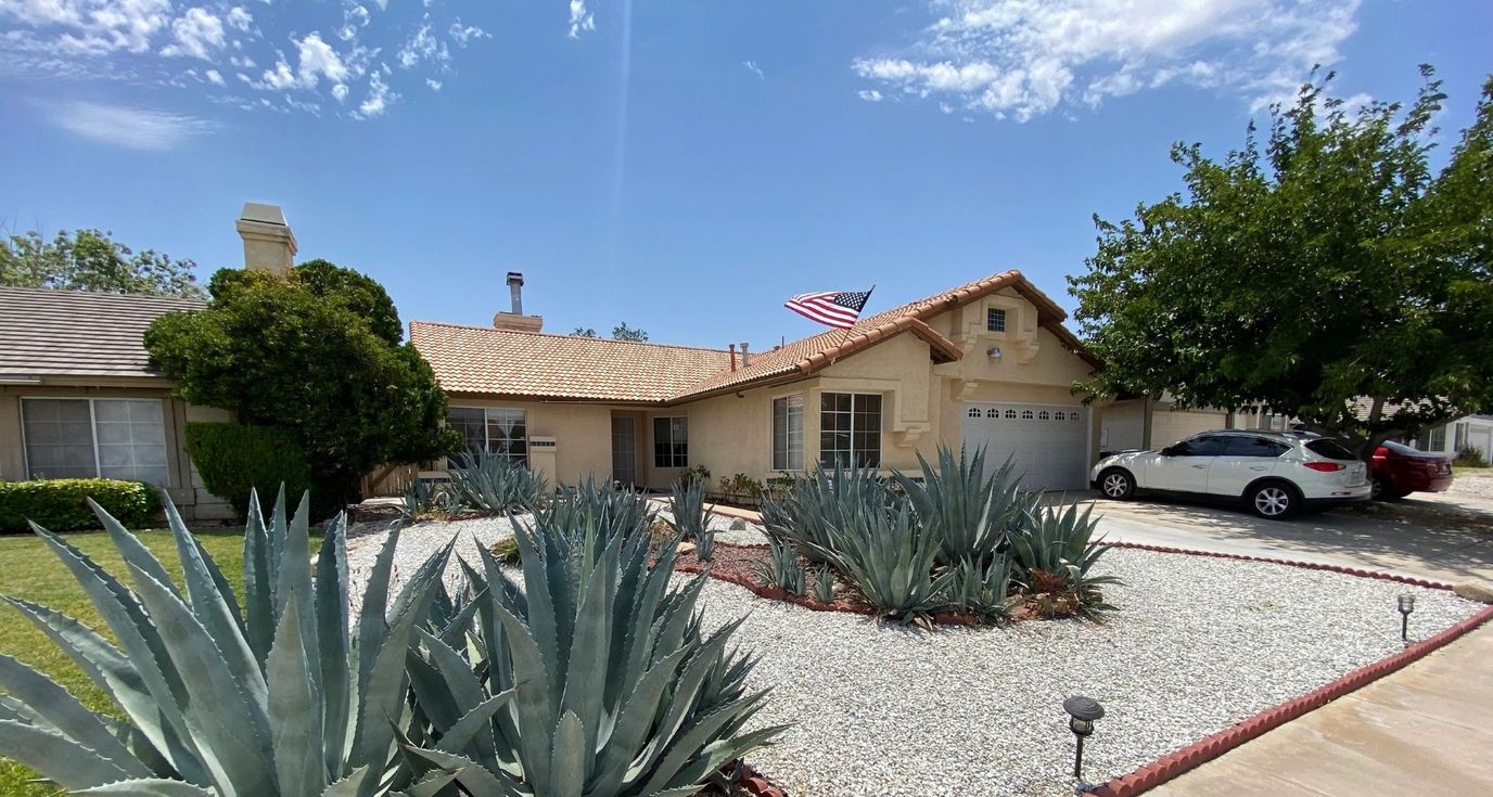 Exterior view of the facility with landscaped garden