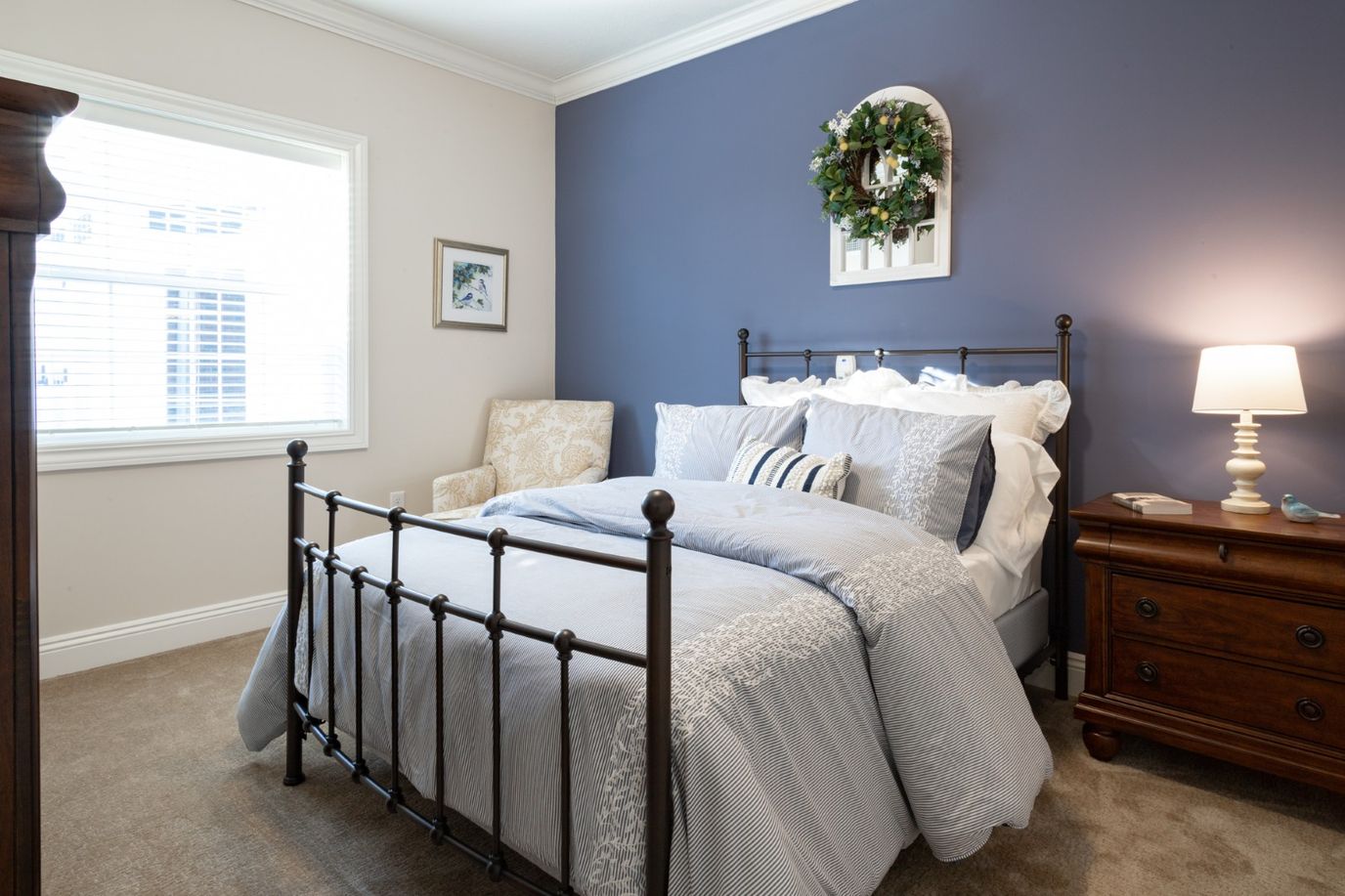 Cozy private resident room with a bed and armchair