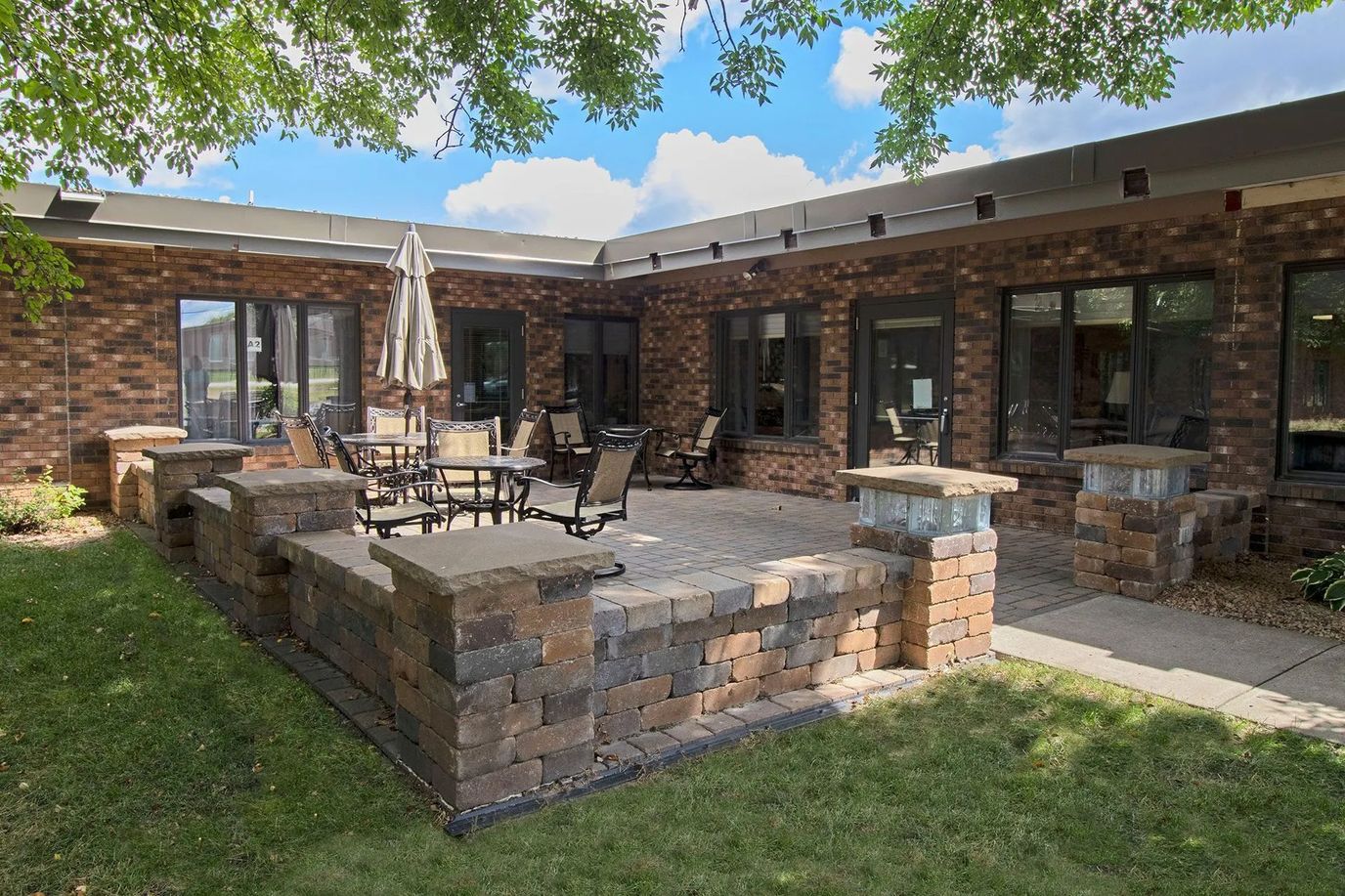 Outdoor seating area with tables and chairs