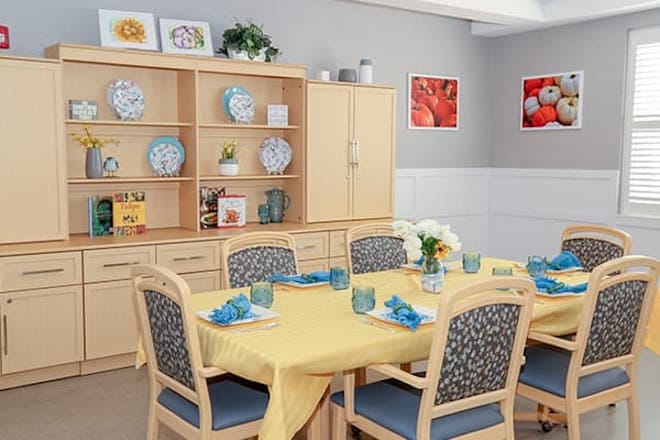 Bright dining area with a set table for meals