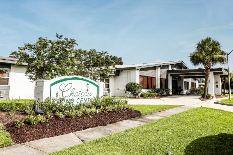 Exterior view of Chateau Living Center with sign