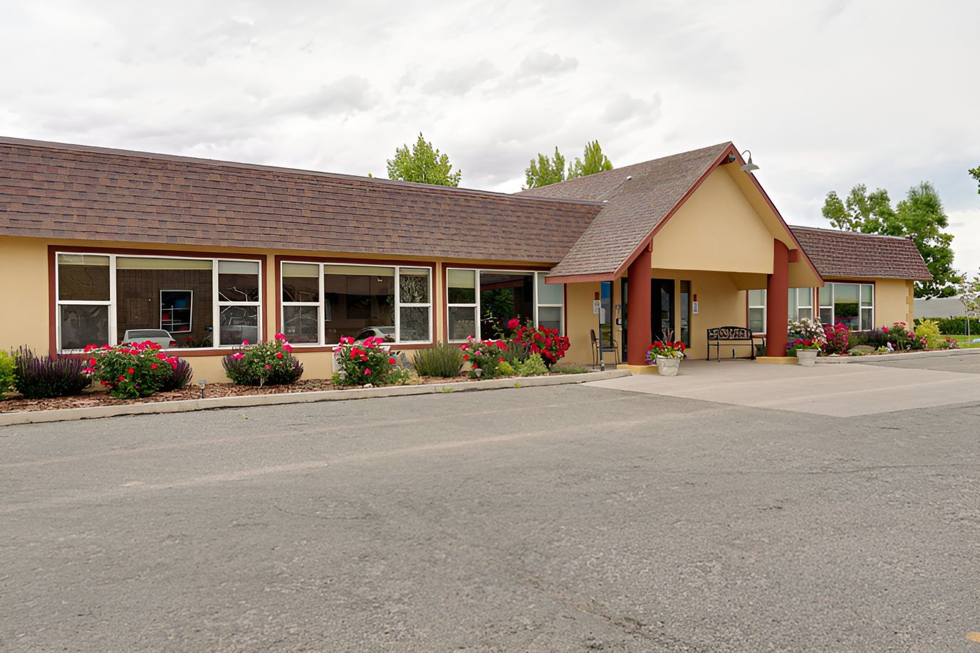 Exterior view of a senior living facility with flowers
