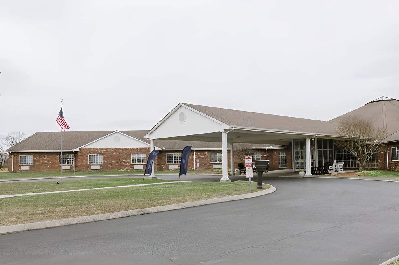 Exterior view of Manchester Center with entrance and flag