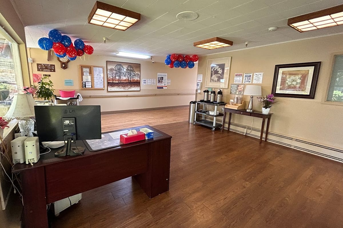 Bright common area with decorative balloons and seating