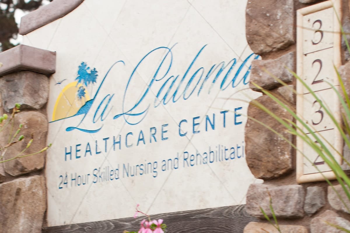 Facility logo on a stone sign