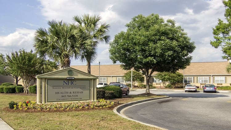 Exterior view of NHC HealthCare Charleston with signage