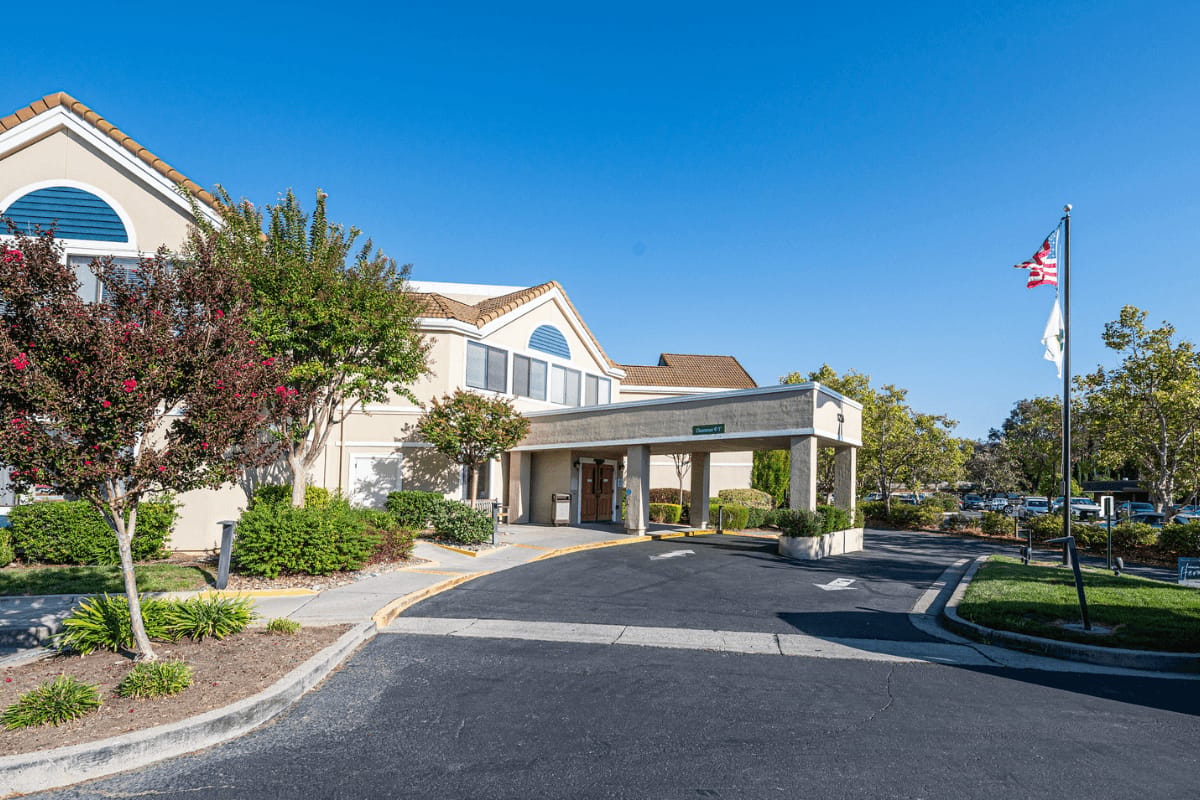 Exterior view of the facility with landscaped entrance